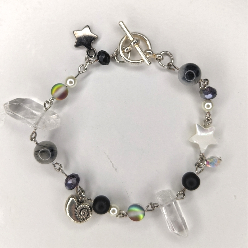Bracelet with charms a toggle clasp and stars. Handmade by me.